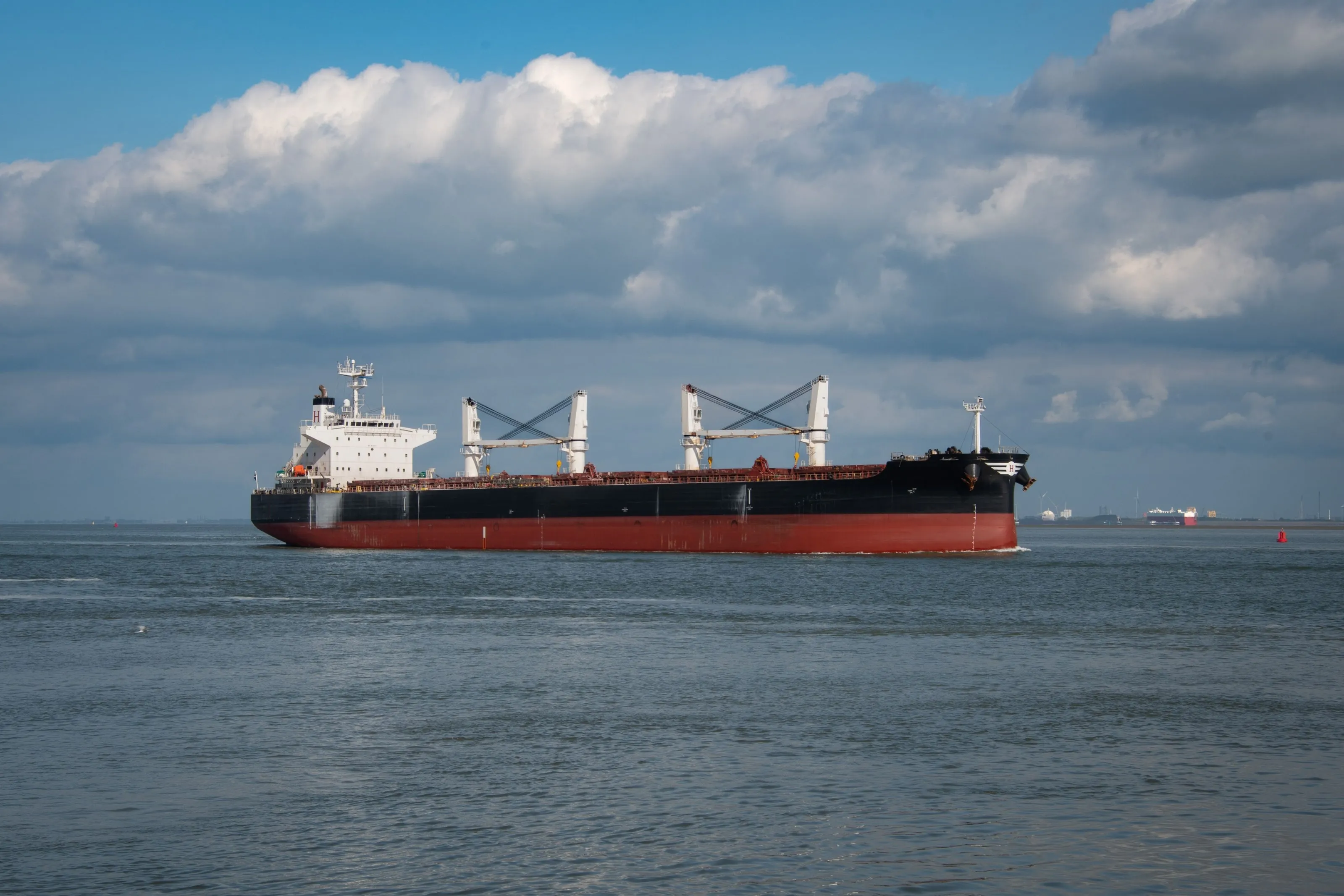 Geared dry bulk carrier underway on open sea